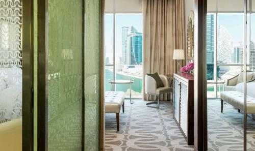 a hotel room with a view of the city at Hilton Dubai Al Habtoor City in Dubai