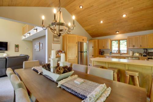 a dining room and kitchen with a table and chairs at Lakefront Brainerd Cabin with Fireplace! in Brainerd