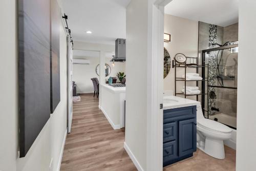 a bathroom with a sink and a toilet and a tub at Tower 9 #6 in Oceanside