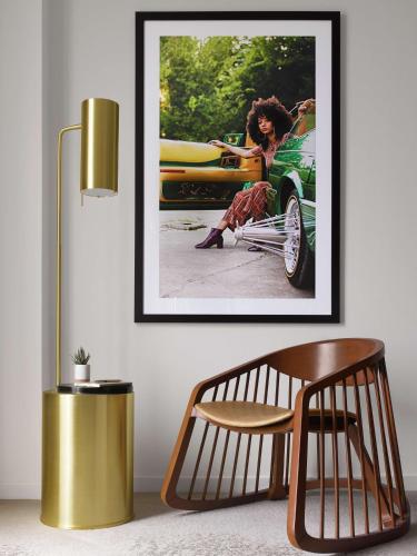 a picture of a woman sitting in a car at C. Baldwin, Curio Collection by Hilton in Houston
