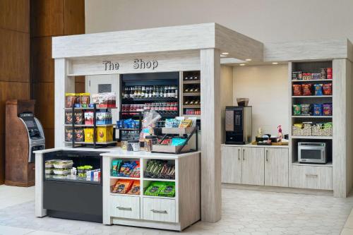 a shop with a counter with food and drinks at Hampton Inn & Suites Atlanta-Midtown, Ga in Atlanta