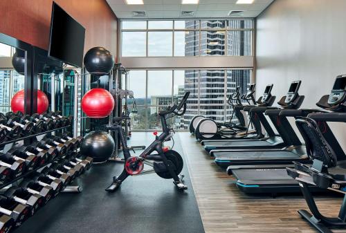 a gym with treadmills and exercise bikes in a room at Hampton Inn & Suites Atlanta-Midtown, Ga in Atlanta