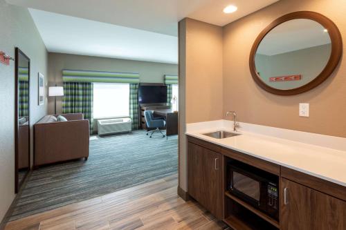 a bathroom with a sink and a mirror in a room at Hampton Inn Eden Prairie Minneapolis in Eden Prairie