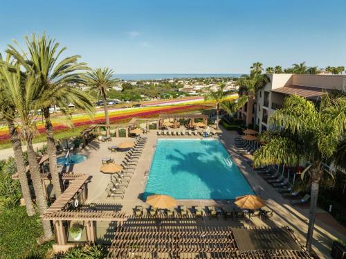 an overhead view of a pool with chairs and a train at The Cassara Carlsbad, Tapestry Collection By Hilton in Carlsbad