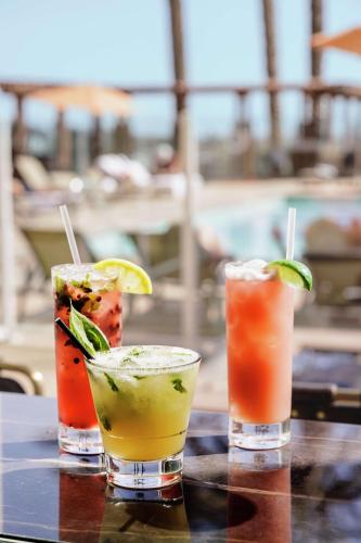 a group of three cocktails sitting on a table at The Cassara Carlsbad, Tapestry Collection By Hilton in Carlsbad
