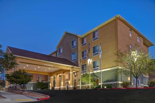 a rendering of the front of a hotel at Homewood Suites by Hilton Albuquerque Airport in Albuquerque