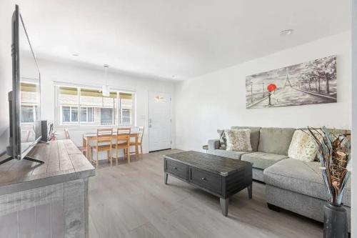 a living room with a couch and a table at 2BR APT with Brand new super quite AC, Washer, Dryer, Free EV Station, Free Parking in Cupertino in Sunnyvale