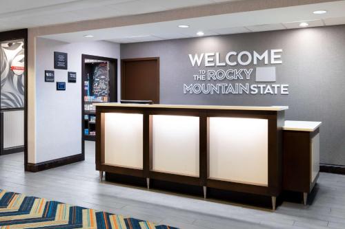 a welcome sign for the rocky mountain state hospital at Hampton Inn Denver-International Airport in Denver