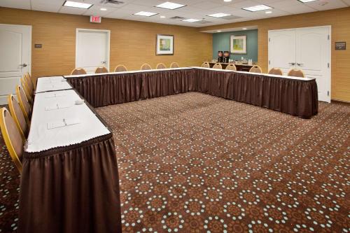 a conference room with chairs and a long table at Hampton Inn and Suites St. Cloud in Saint Cloud