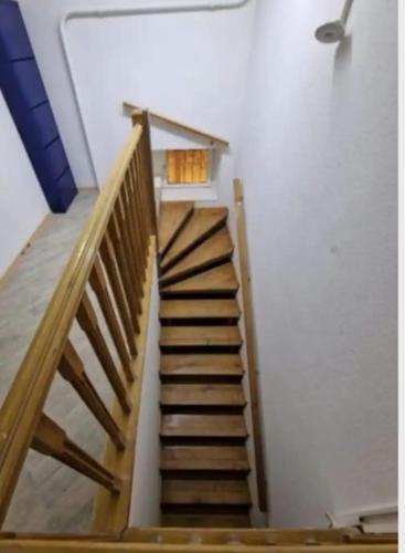 a wooden staircase in a room with a stair case at 7DAB 8 contactless self check-in in Budapest