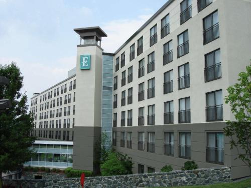 a building with a clock tower in front of it at Embassy Suites by Hilton Boston Marlborough in Marlborough