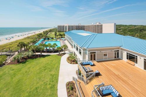 an aerial view of a resort with a pool and the beach at DoubleTree Resort by Hilton Myrtle Beach Oceanfront in Myrtle Beach
