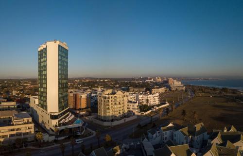 an aerial view of a city with a tall building at Radisson Blu Hotel, Port Elizabeth in Port Elizabeth