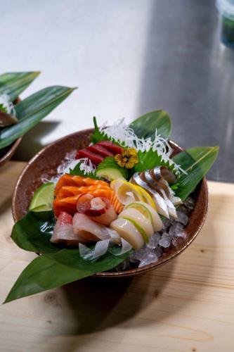 a plate of food with vegetables on a table at Telegraphenamt in Berlin