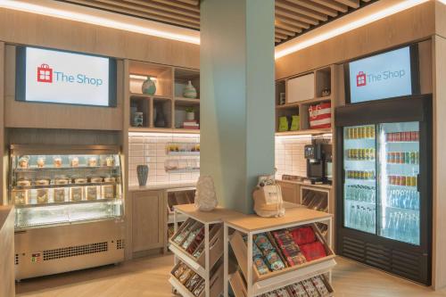 a store interior with a shop with shelves and food at Hilton Garden Inn Umhlanga Arch in Durban