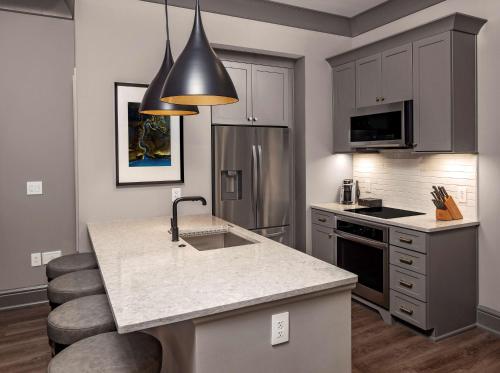 a kitchen with a sink and a counter top at Hilton Club Liberty Place Charleston in Charleston