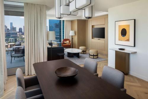 a room with a dining table and a living room at Conrad Nashville in Nashville