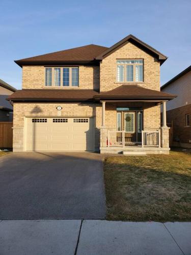 a large brick house with a large garage at 4 BD Family Retreat - Basement not Included in Stratford
