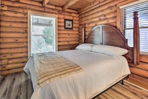 a bedroom with a bed in a log cabin at Smokey Mountain Hideaway in Gatlinburg