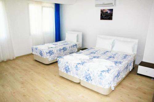 Cama o camas de una habitación en Mavi Butik Apart