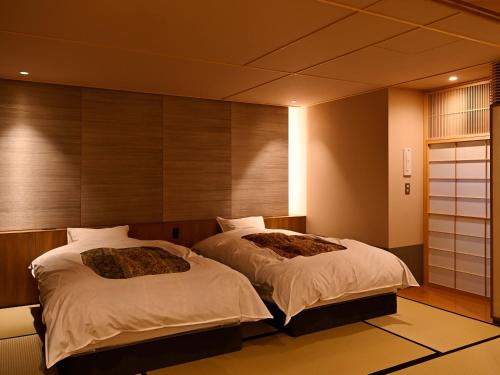 Ein Bett oder Betten in einem Zimmer der Unterkunft Beniya