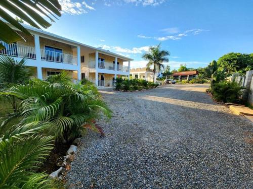 an empty road in front of a building at Bella Villa Roomy apartment at 5 min walk to the beach in Las Galeras