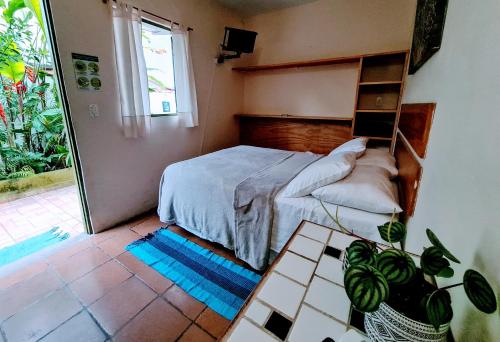 Postel nebo postele na pokoji v ubytování Praia Suítes Itagua Ubatuba