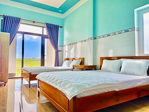 Giường trong phòng chung tại Hồng Phú Motel - Đảo Phú Quý