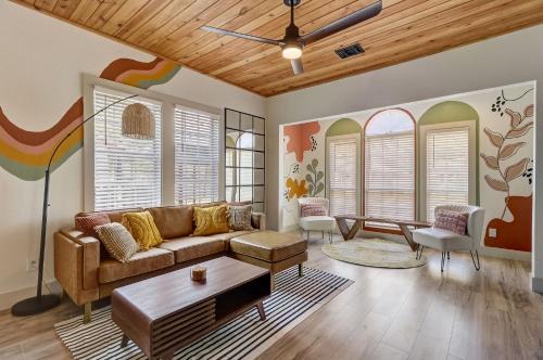 a living room with a couch and a table at The Retro Retreat - Close to Downtown, Fort Sam in San Antonio