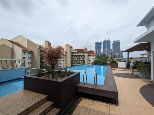 a swimming pool on the roof of a building at Damansara Semantan Suites in Kuala Lumpur