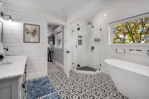 a white bathroom with a tub and a shower at Dragonfly Healdsburg A Wine Country Escape in Healdsburg