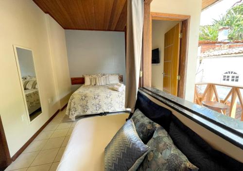 Una cama o camas en una habitación de Pousada Estevao