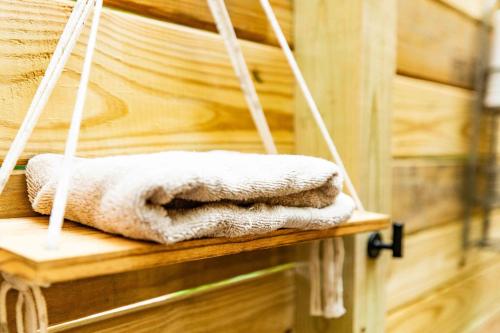 a couple of towels are sitting on a shelf at Solace glamping in Sevierville