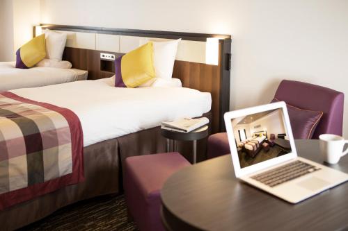 Ένα ή περισσότερα κρεβάτια σε δωμάτιο στο HOTEL MYSTAYS Shinsaibashi