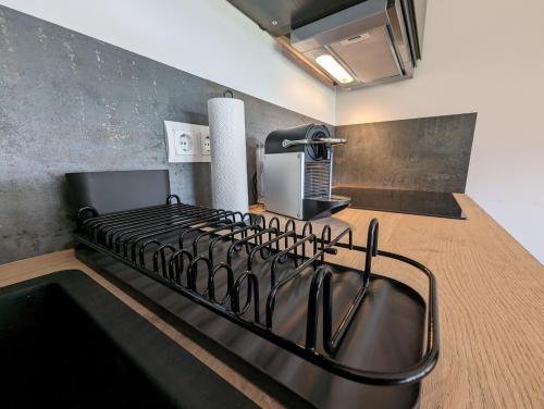 a kitchen with a stove top oven in a room at Bergkultur Sauerland in Medebach