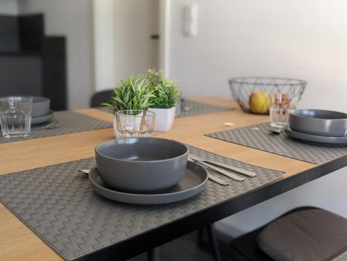a table with bowls and plates on top of it at Bergkultur Sauerland in Medebach