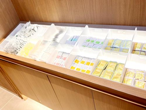 a display case with many different types of books at Hotel Elcient Osaka Umeda in Osaka