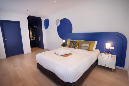 Postel nebo postele na pokoji v ubytování Ukiyo Suites