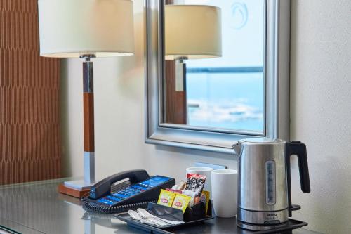 a coffee maker on a table in a hotel room at Hilton Alexandria Corniche Hotel in Alexandria