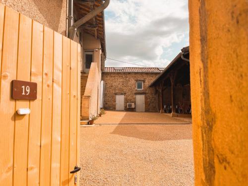 an empty courtyard of a building with a number on it at Bulles en Beaujolais in Fleurie