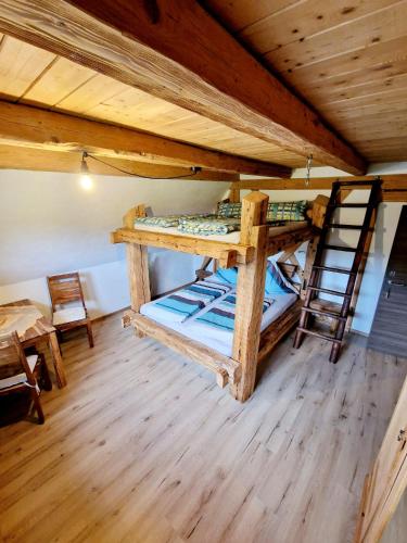 a room with two bunk beds in a cabin at Wood & Stone Lodge 2 in Donaueschingen