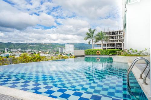 a swimming pool on top of a building at Eon Centennial Soho Hotel in Cebu City