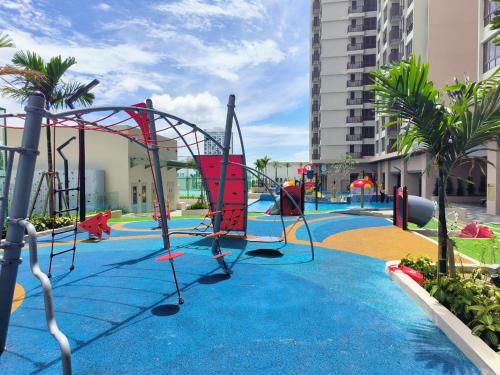 a playground with a roller coaster in a resort at Wanz Barakah Homestay @ Bali residence in Melaka