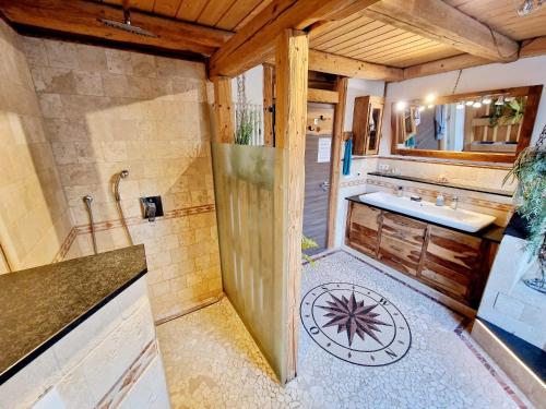 a bathroom with a shower and a sink at Wood & Stone Lodge 2 in Donaueschingen