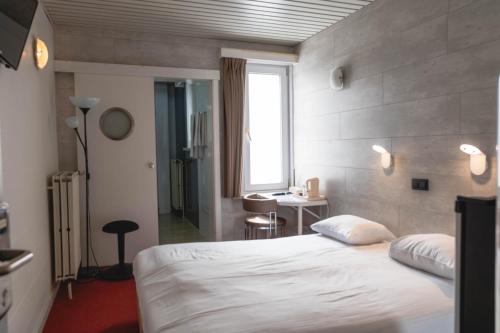 Postel nebo postele na pokoji v ubytování Hotel Richmond