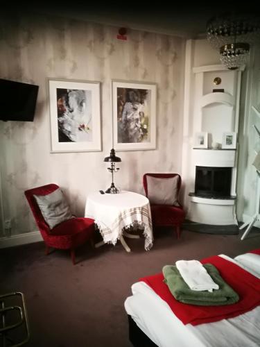 Postel nebo postele na pokoji v ubytování Hotell Floras Trädgård