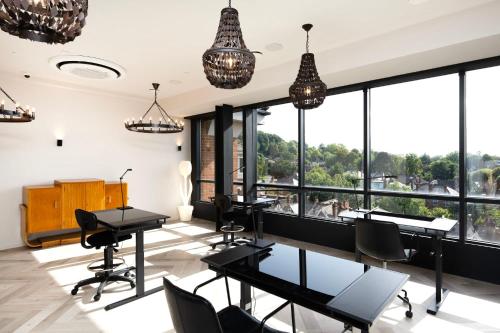 an office with tables and chairs and large windows at The Hill by Nestor in Harrow