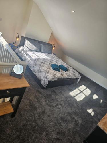 a bedroom with a bed and a desk in it at Carlisle City Centre. The Foremans Residence. in Carlisle