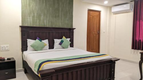 Säng eller sängar i ett rum på Fort Malabar