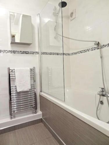 a bathroom with a shower and a glass shower backdoor at The Brighton Parlour with Hot Tub in Brighton & Hove